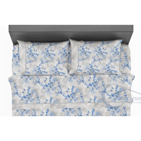 Drap en pur coton avec fleurs stylisées sur le bleu