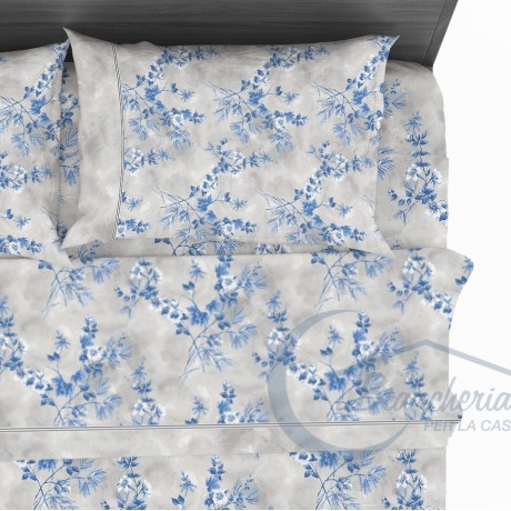 Drap en pur coton avec fleurs stylisées sur le bleu